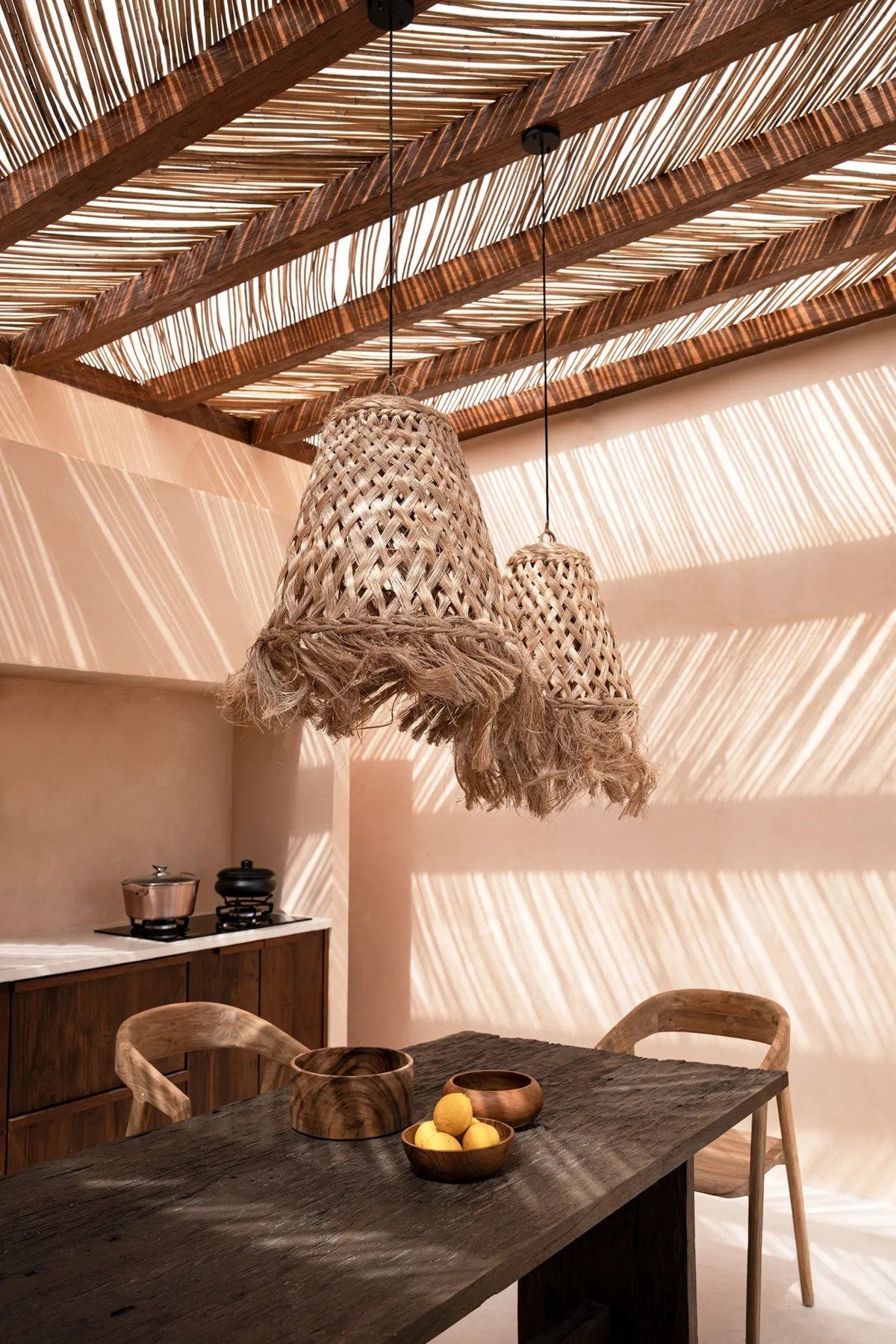 Abaca Jelly Fish Pendant Light – Natural, Medium – styled above a dining table beneath a timber roof