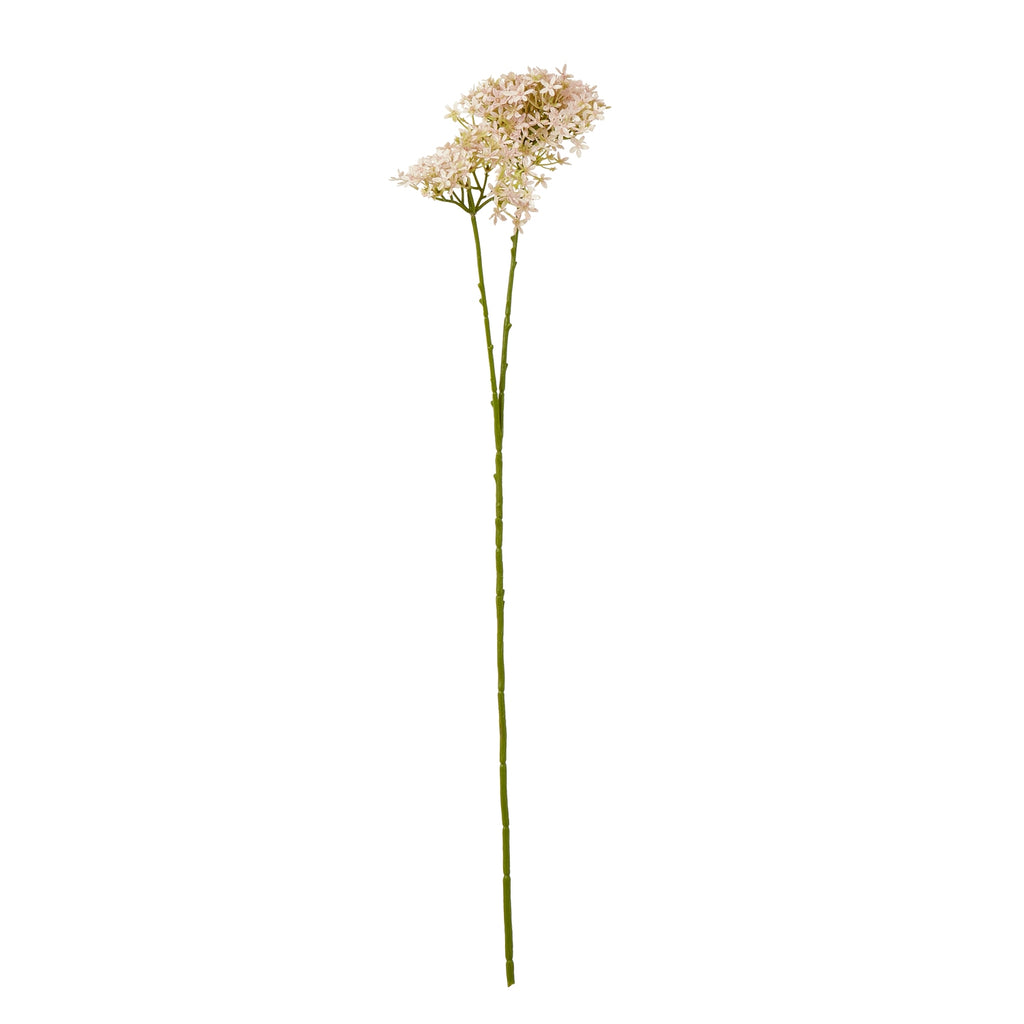 Full view of a pale pink artificial botanical spray with a long green stem branching beneath loose flower clusters on a white background.