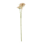 Full view of a pale pink artificial botanical spray with a long green stem branching beneath loose flower clusters on a white background.