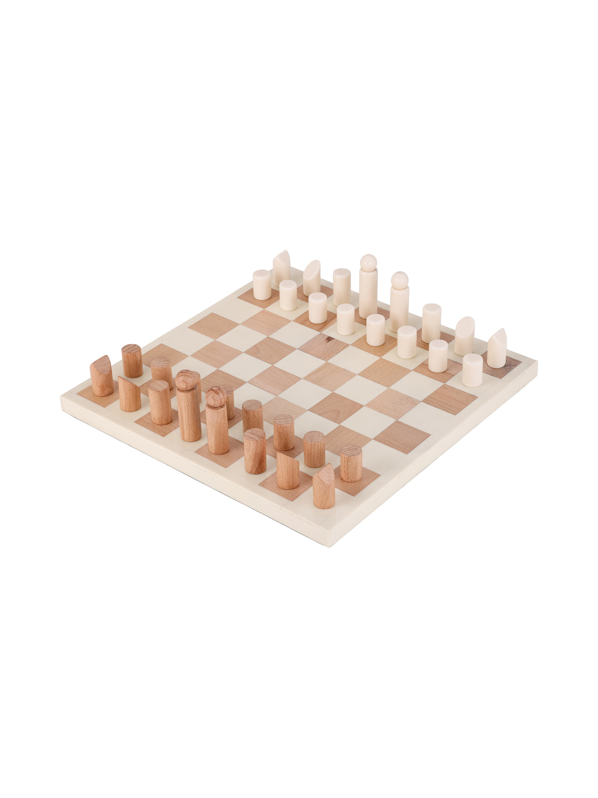 Angled view of a wood-toned and ivory chequered chess board with coordinating cylindrical pieces arranged along opposite edges, on a white background.