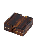Four square amber and dark brown coasters stacked in their matching holder, with a fine brass line around the sides.