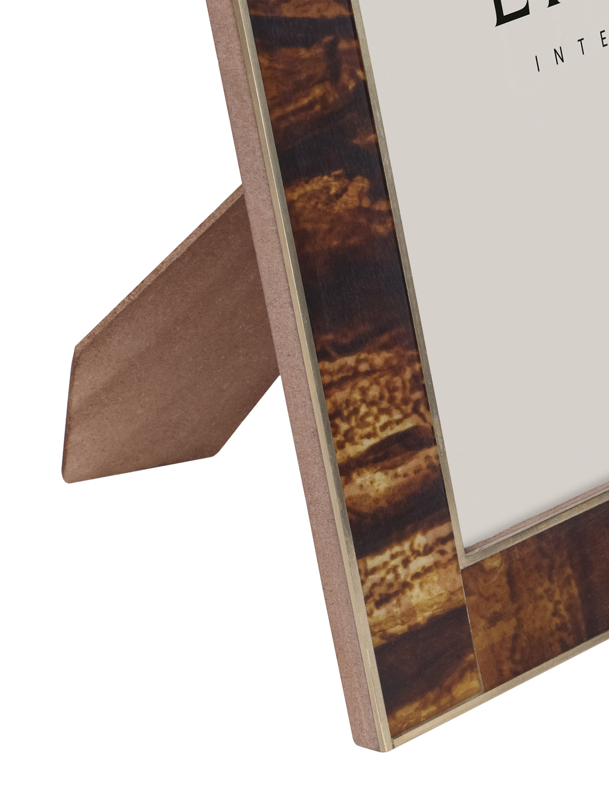 Detail of the frame's lower left corner and side, showing the glossy brown and amber border, brass edging and open rear stand.