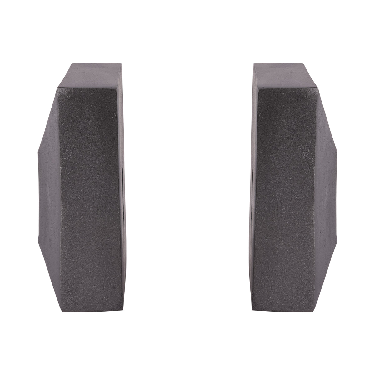 Side view of the two bookends spaced apart, showing their thick rectangular profiles and sloping outer faces.