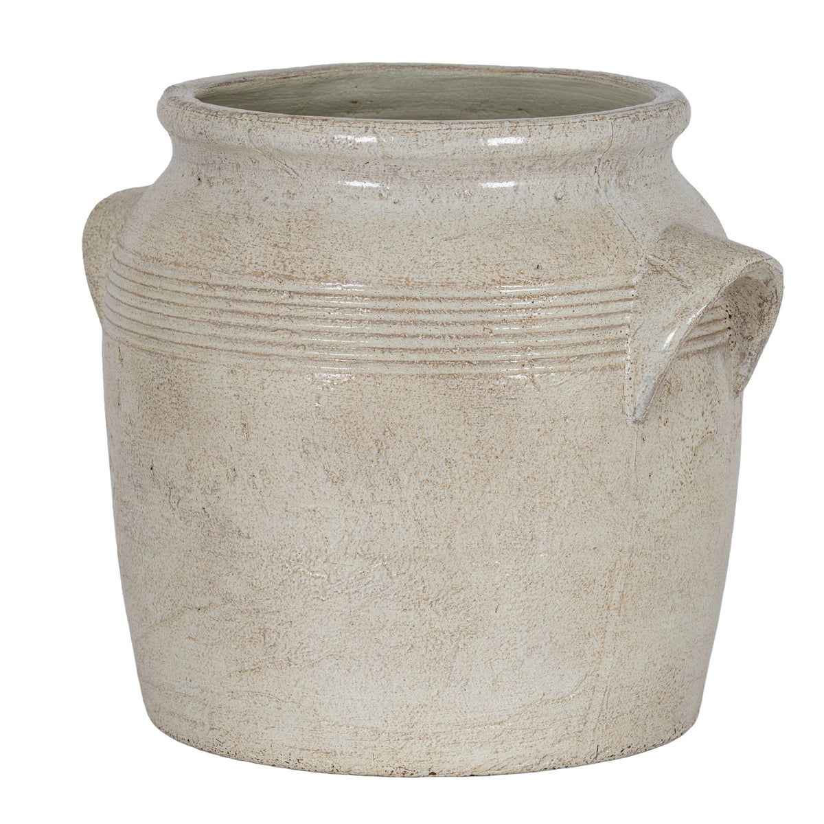 Cream planter viewed at an angle, showing its open flared rim, banded shoulders and projecting right-hand handle.