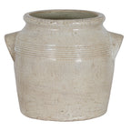 Front view of the rounded cream planter with handles extending to either side and warm-beige mottling across the body.