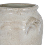 Close-up of the planter's flared rim, horizontal shoulder bands and right angular handle, showing the mottled surface and gentle sheen.