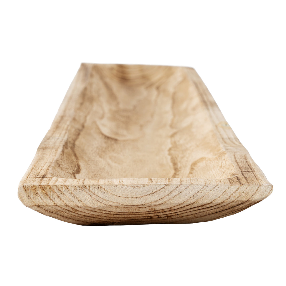 Close-up looking along a tray's recessed interior, with the angular front end and sweeping brown grain in focus.
