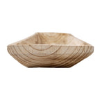 Low close-up across a tray end, showing curved darker grain on the raised front edge and sloping sides behind it.