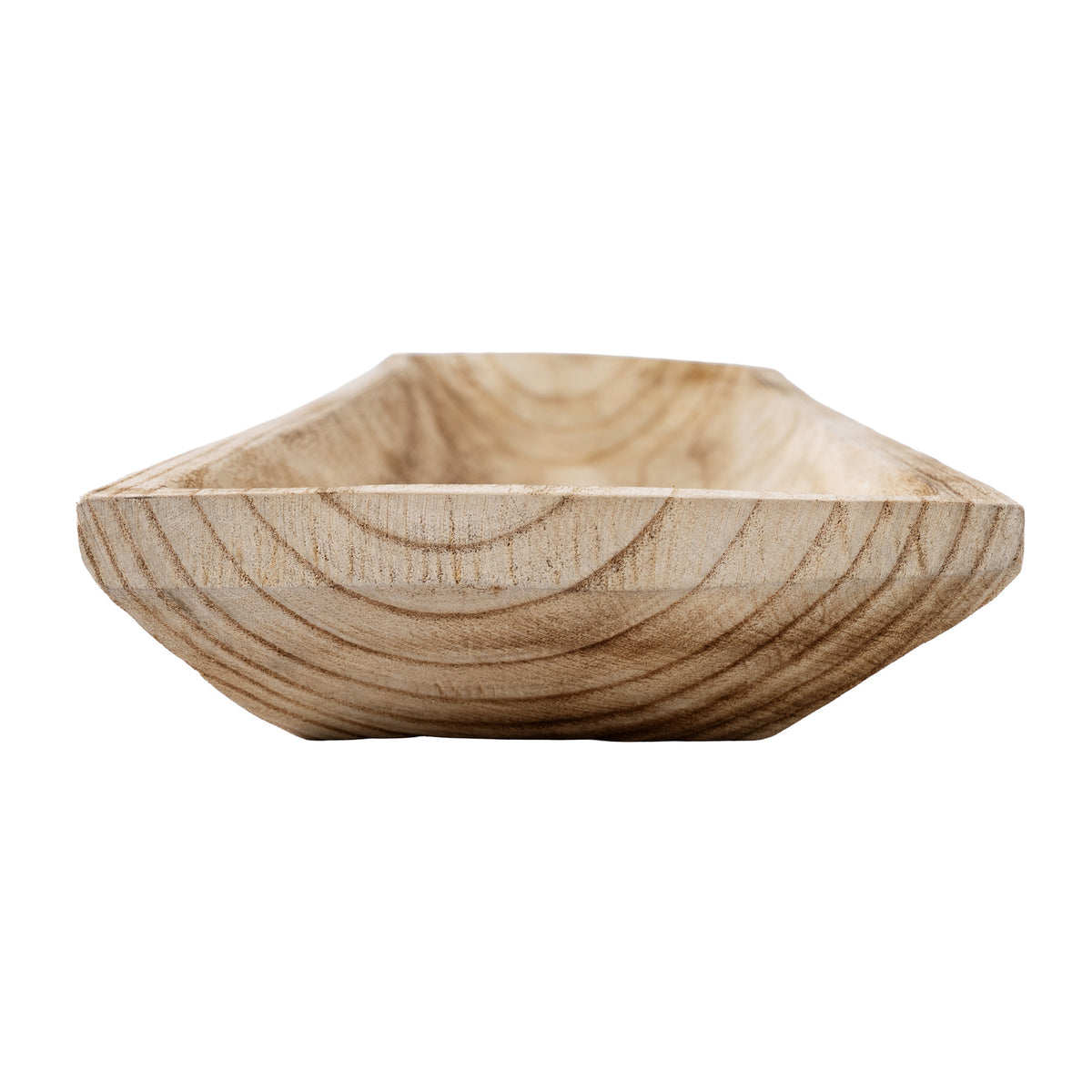 Low close-up across a tray end, showing curved darker grain on the raised front edge and sloping sides behind it.
