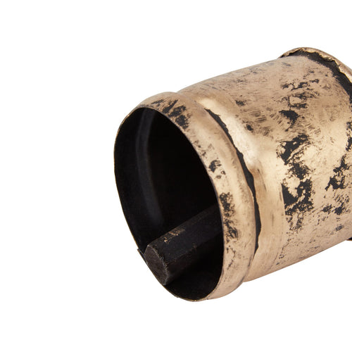 Angled close-up of the ornament's open flared rim, showing the dark interior and clapper-like element beneath the mottled gold exterior.