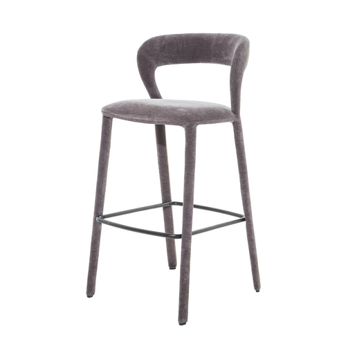 Three-quarter front view of the grey Arc bar stool, showing its curved open back, upholstered legs and black footrest.