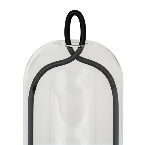 Close-up of the black oval loop and crossing curved frame at the rounded top of the clear cloche.