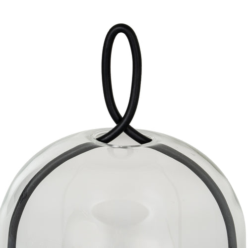 Close-up of the black oval loop crossing at the top of the clear cloche, with the curved side frame visible below.