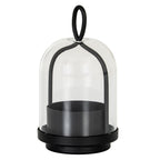 Black candle holder with a deep round cup, stepped base and arched frame beneath a clear bell-shaped cloche, topped by an oval loop.