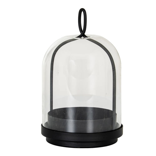 Black candle holder with a stepped round base, deep candle cup and arched frame beneath a clear bell-shaped cloche, topped by an oval loop.
