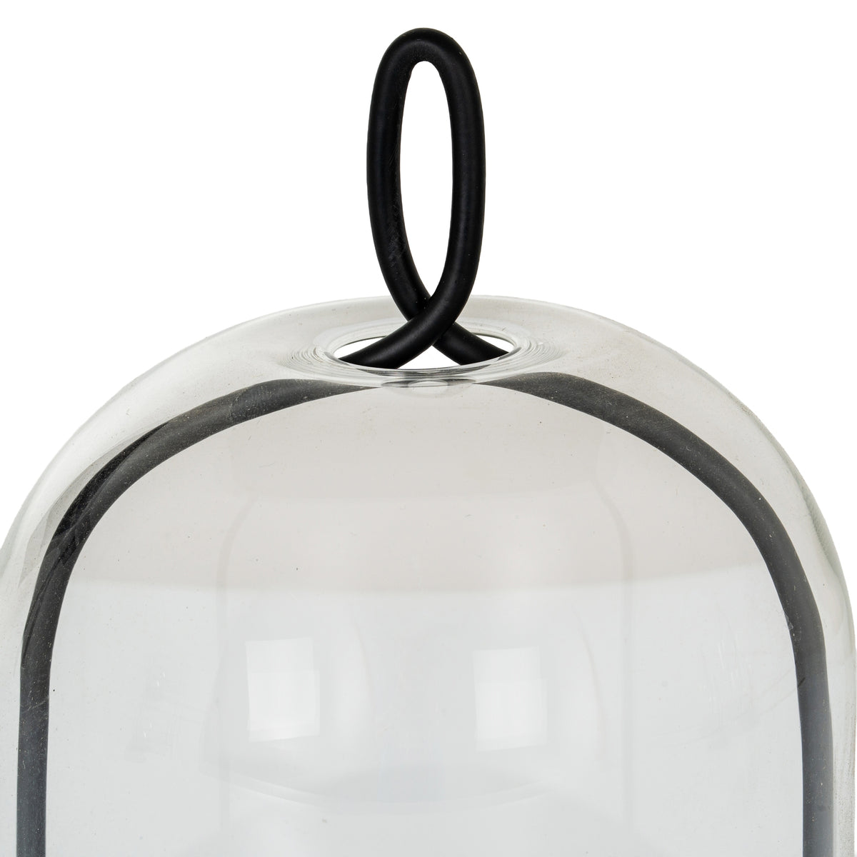 Close-up of the black oval loop passing through the circular opening at the top of the clear cloche, with the curved frame visible below.