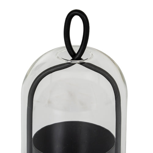 Close-up of the oval black loop above the rounded clear cloche, with the curved side frame and open candle cup visible below.
