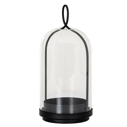 Full view of the black Archloop candle holder with a stepped round base, deep candle cup and arched frame beneath a clear bell-shaped cloche.