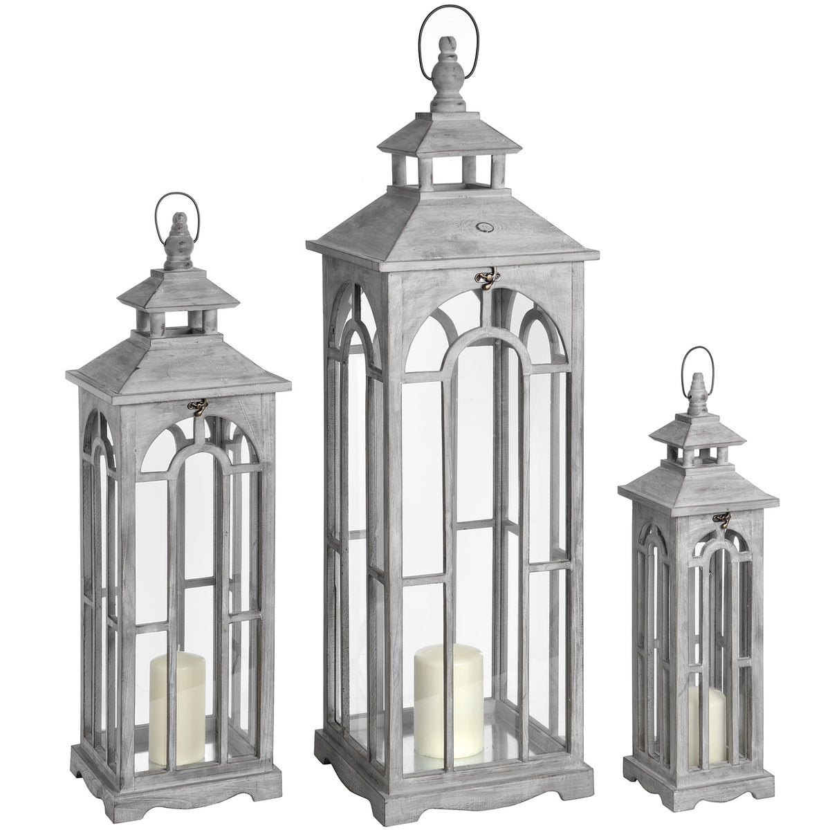 Three pale grey Archwindow lanterns in graduated sizes, with pitched roofs, loop tops and cream pillar candles shown inside.