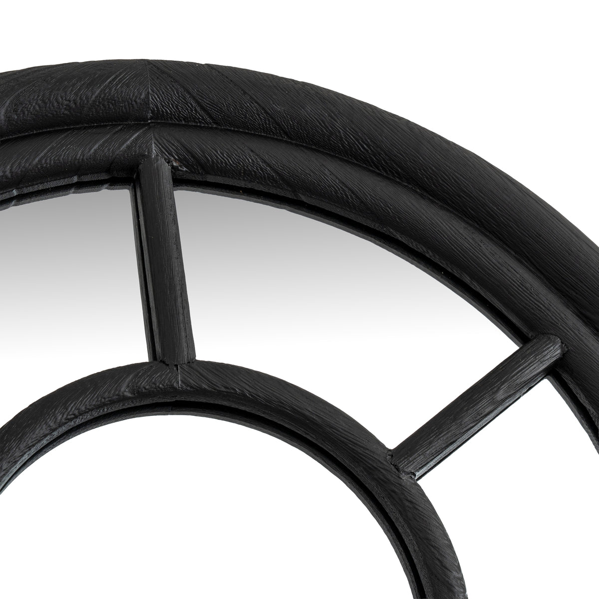 Close-up of the curved outer frame above the smaller inner arch, with a central vertical bar and a diagonal bar to the right.