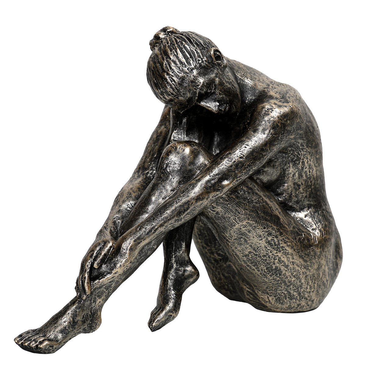 Three-quarter view of the antique gold seated female sculpture, with bowed head, crossed wrists and one leg extended forwards.