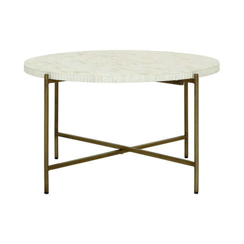 Low view of the round coffee table showing the segmented tabletop edge, four slender legs and low X-shaped rails.