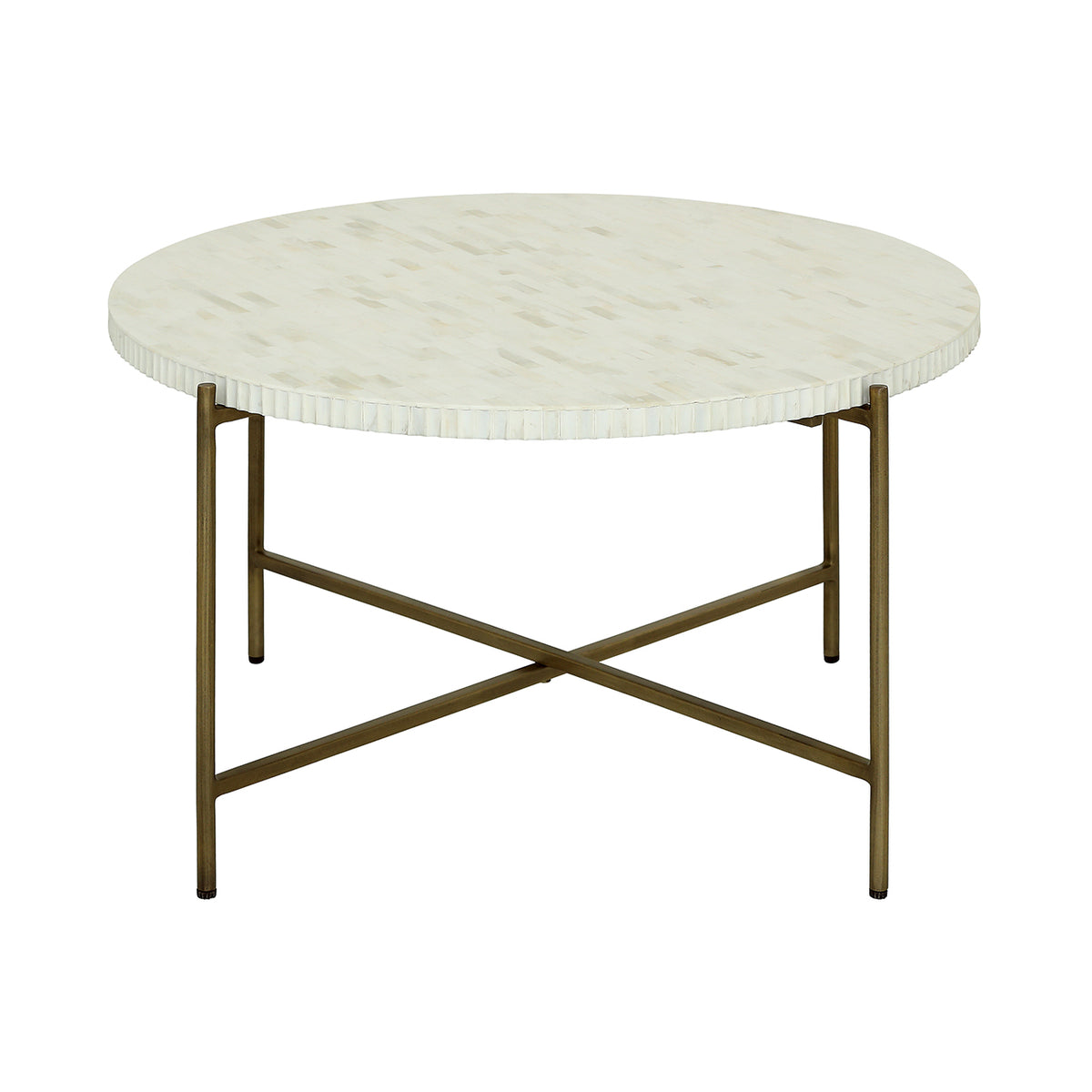 Atrium coffee table viewed at an angle, showing its pale circular inlay top and aged brass-coloured frame with crossing rails.