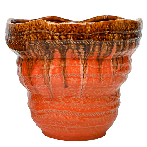 Front view of the orange and brown Aubade planter, showing its broad waved rim, textured bands and tapered base.