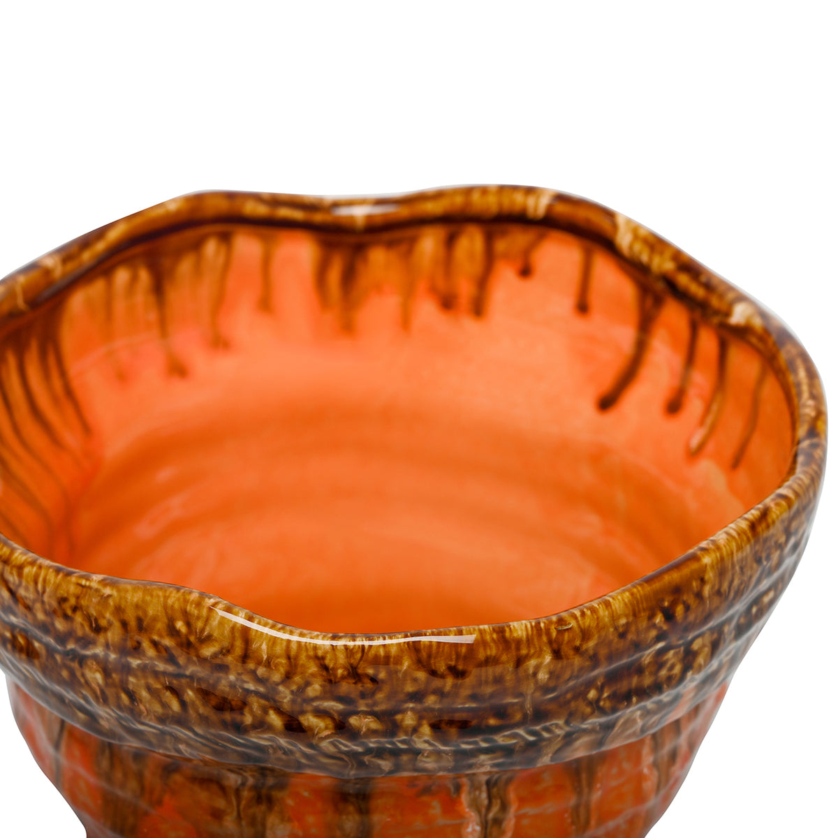 Close-up looking into the planter, showing glossy orange interior glazing and brown runs beneath the amber rim.