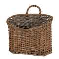 Empty brown woven basket viewed from above the front, showing its curved front rim, taller back and central arched loop against a white background.