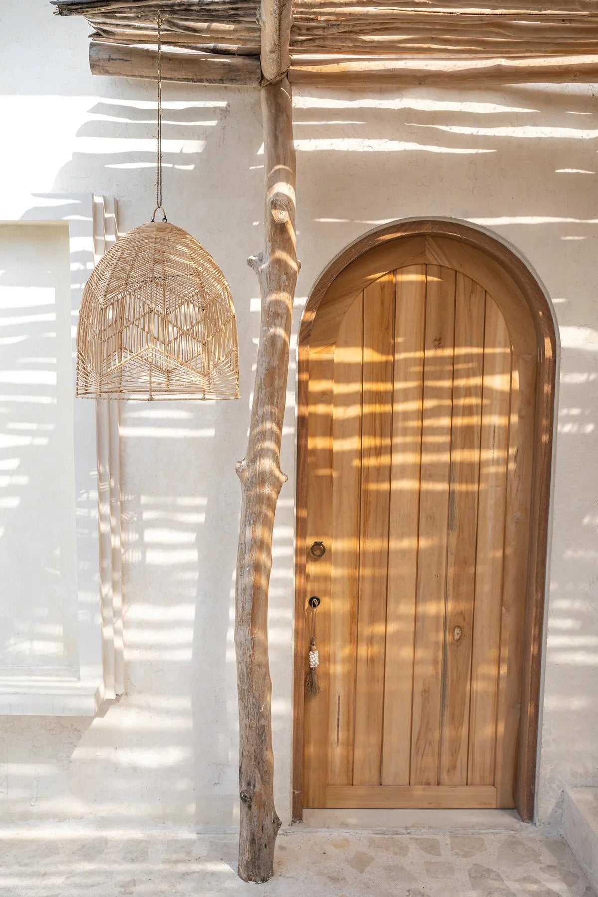 Bala Rattan Pendant Light – Natural, Large — styled beside natural materials