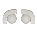 Two off-white ball-and-arch bookends facing one another against a white background, with textured spheres beneath thick squared arches.