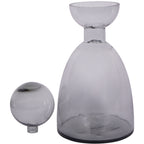 Grey glass bottle vase with its ball removed and placed beside it, revealing the open, bowl-shaped rim.