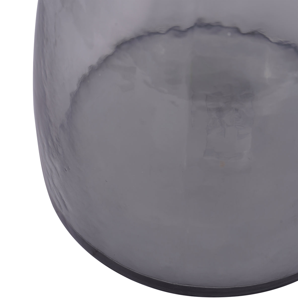 Close-up of the vase's curved grey glass body and dark base edge, with the base visible through the tinted surface.