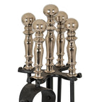 Close-up of five reflective silver-toned ball finials above the black rack, with the central finial standing tallest.