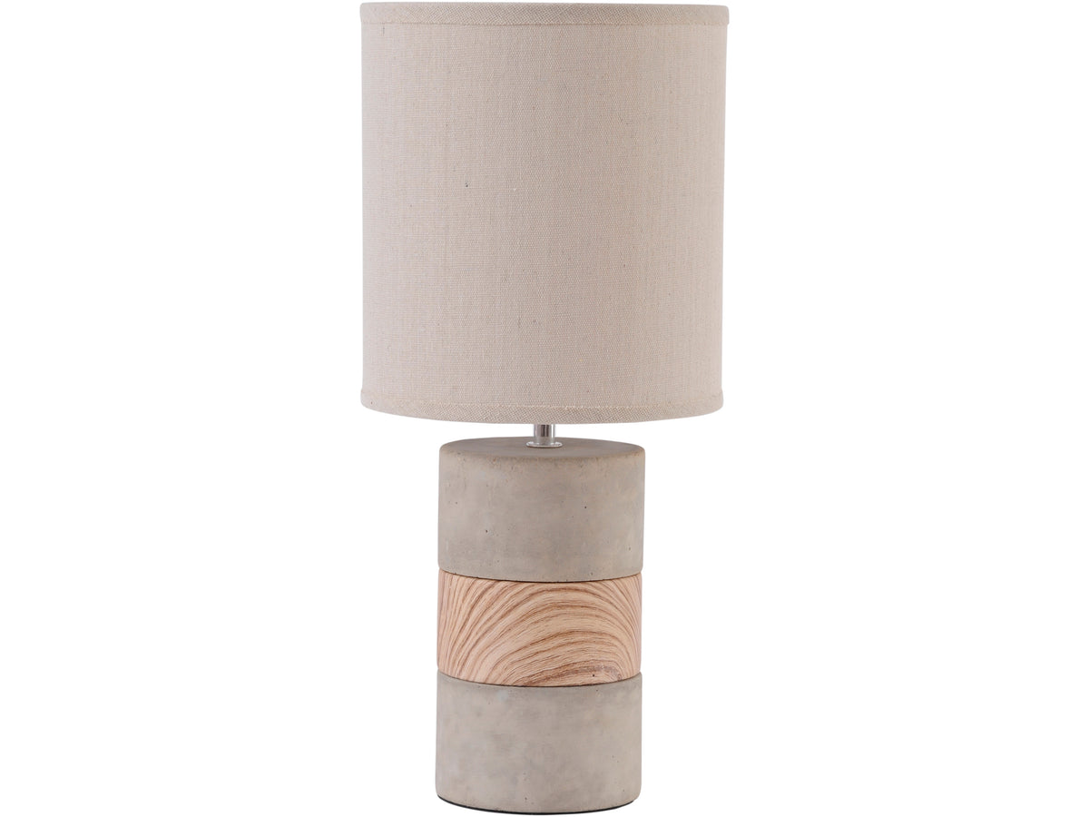 Table lamp against a white background, with a tall natural-coloured cylindrical shade and three-part base featuring a curved brown pattern on the middle band.
