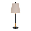 Bandline table lamp on a white background, with a tapered warm-grey shade, black ball finial and slender black stem with gold-coloured sections above a stepped round base.