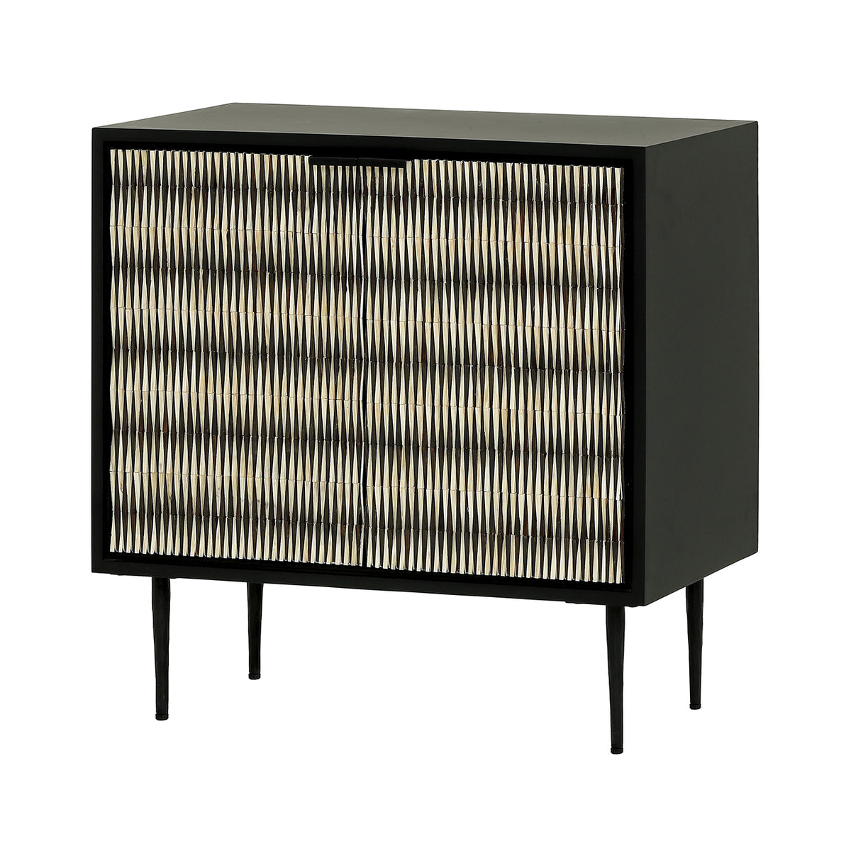 Three-quarter view of the Bastion Cabinet with black and ivory patterned doors, a matt black frame and four slender legs.