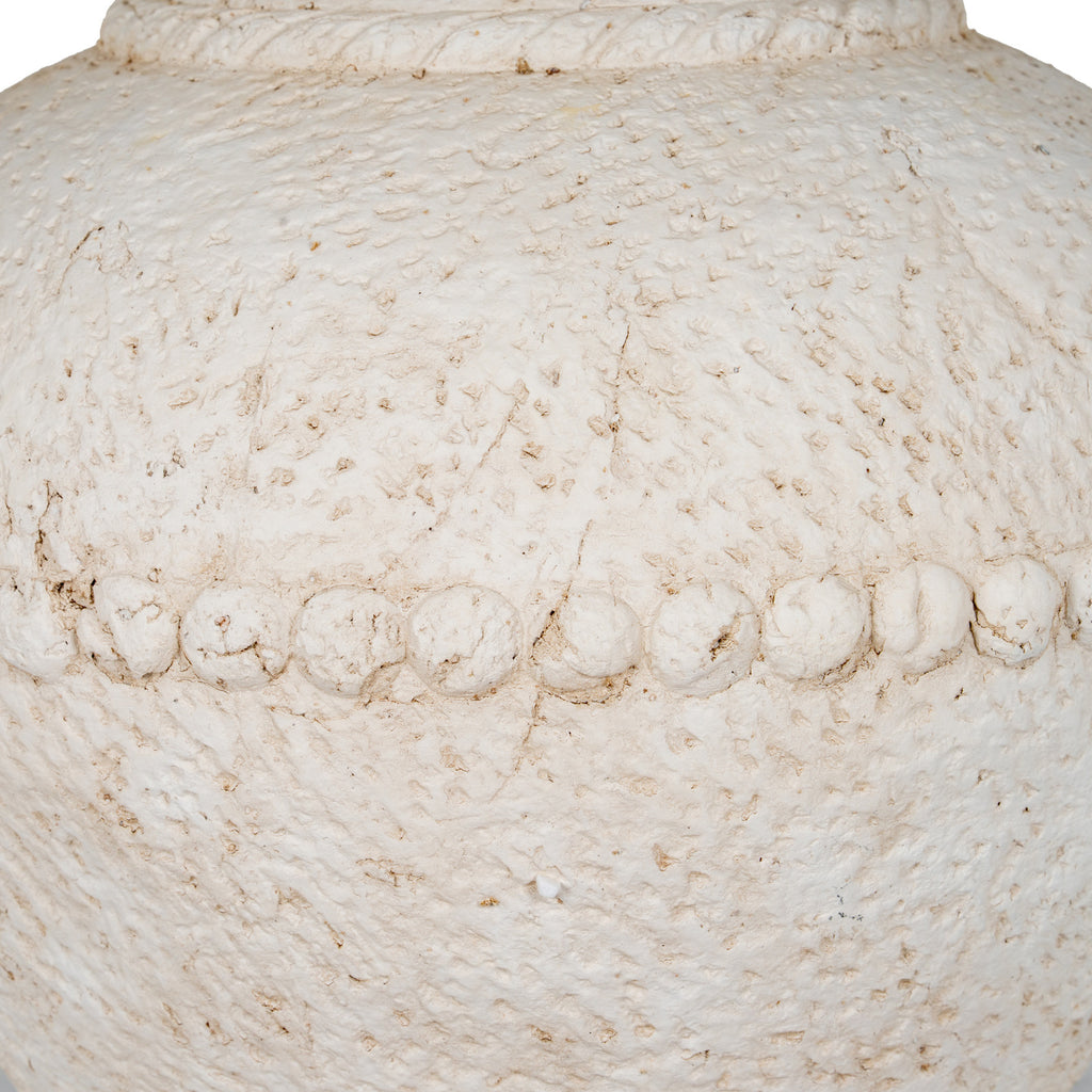 Close-up of the rounded bead-like band across the vase's body, with beige-brown recesses in the chalky textured finish.