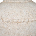Close-up of the rounded bead-like band across the vase's body, with beige-brown recesses in the chalky textured finish.