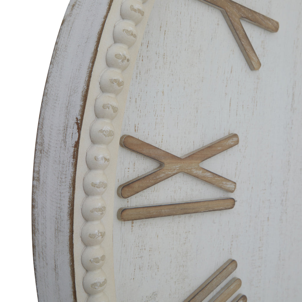 Close-up of the clock's distressed pale rim and rounded bead detailing beside the tan IX numeral.