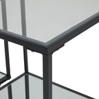 Close view of a side table's upper corner, showing the black border, vertical frame and reflective surface.