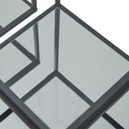 Angled close-up of a reflective lower shelf, with black frame edges and upright reflections forming intersecting lines.