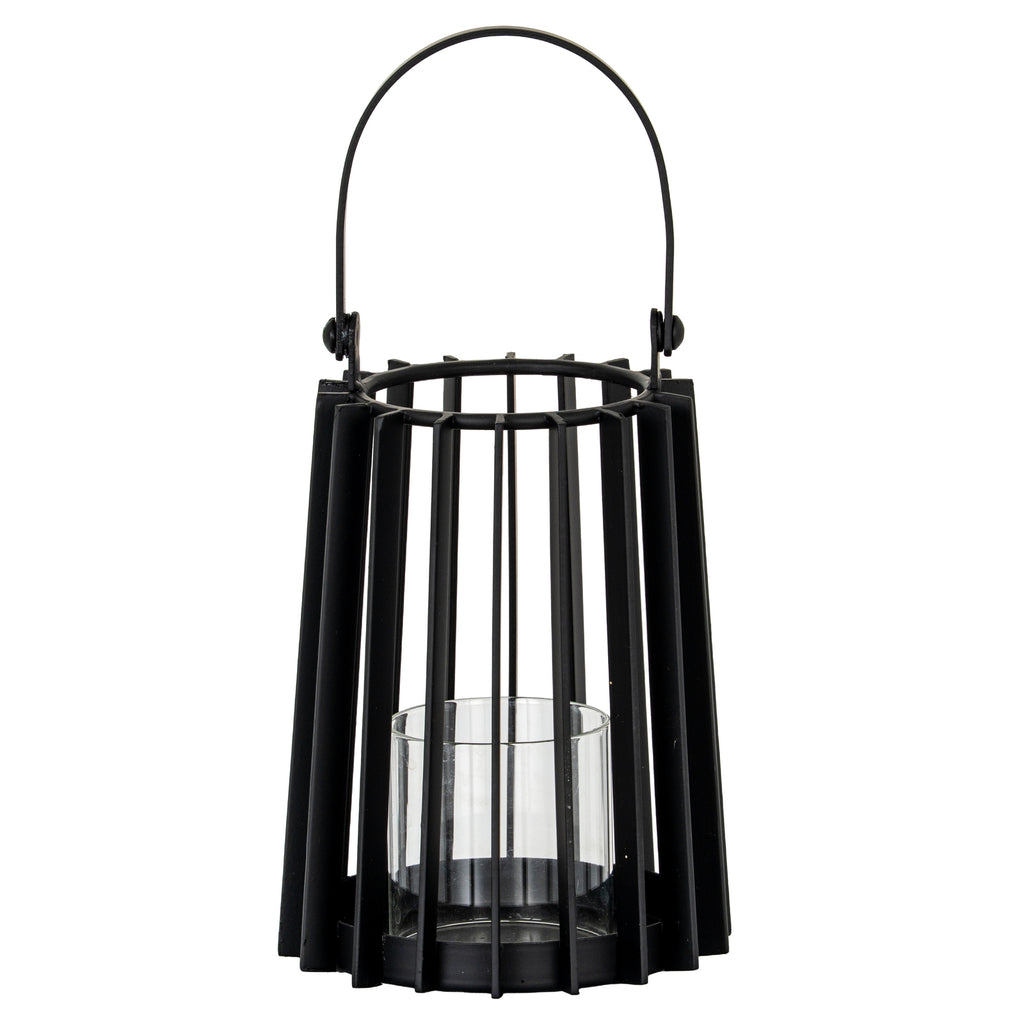Black candle lantern with a tapered vertical-slat frame, raised rounded handle and clear cylindrical holder above a circular base.