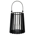 Black candle lantern with a tapered vertical-slat frame, raised rounded handle and clear cylindrical holder above a circular base.
