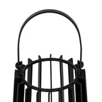 Close-up of the lantern's rounded black handle and side pivots above the circular opening and projecting vertical slats.