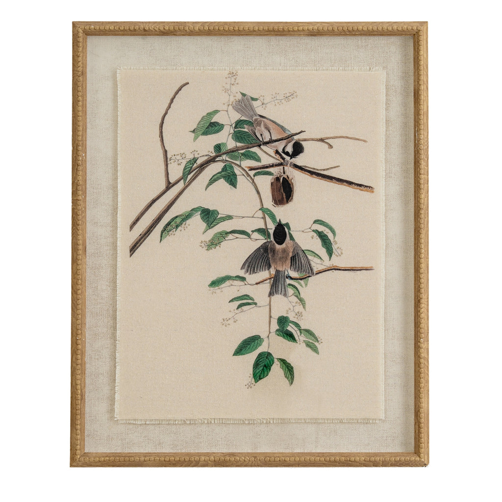 Portrait framed print of two black-capped birds on leafy branches, with a pale textured surround and tan-gold beaded frame.