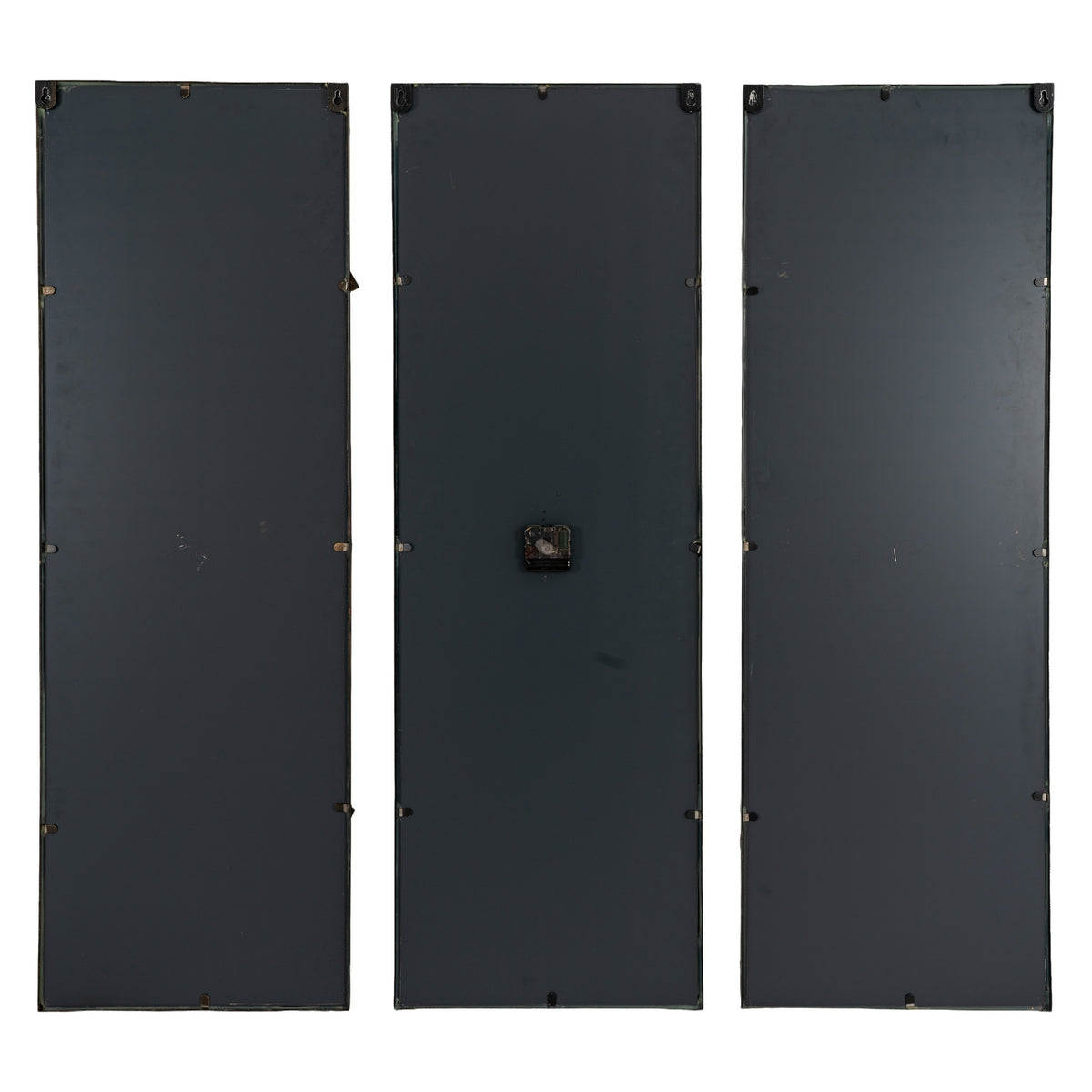 Rear view of three black-backed clock panels, showing hanging hardware near the top and the mechanism on the central panel.
