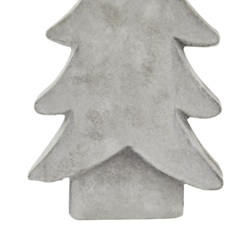 Detail of the tree ornament's lower branches above its rectangular base, showing the chalky white-grey texture and darker edges.