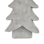 Detail of the tree ornament's lower branches above its rectangular base, showing the chalky white-grey texture and darker edges.